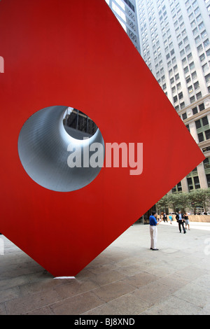 Red Cube Sculpture in New York, USA Stock Photo