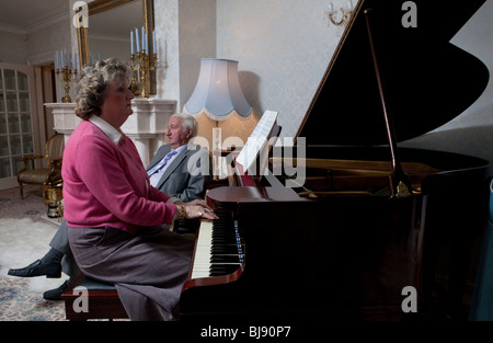 senior couple at home reciting music Stock Photo