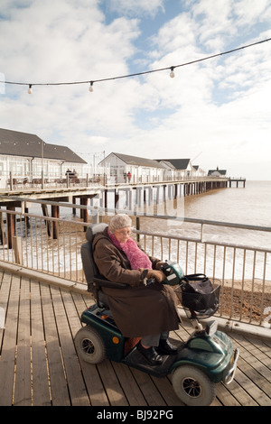 A disabled holidaymaker, Southwold, Suffolk, UK Stock Photo