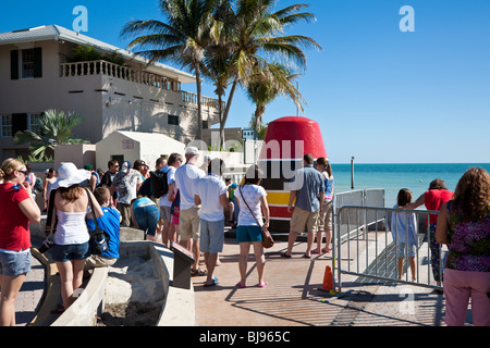 Tourists and cruise passengers gather for photos in front of Southernmost Point Buoy in Key West, Florida Stock Photo