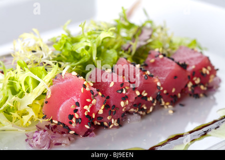 Raw fish tuna with salad frieze Stock Photo