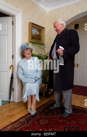 senior married couple getting ready to go to the horse races Stock Photo