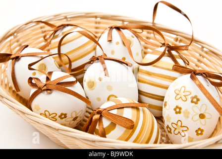 easter eggs in wicker basket Stock Photo