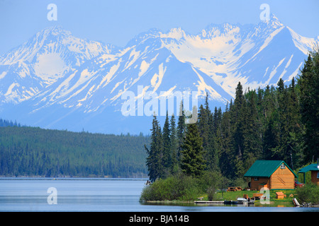 Cabins with mountains in background, Chapman lake, British Columbia Stock Photo