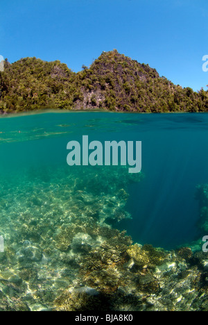 Above under shot of a cove in Raja Ampat, Pacific Ocean Stock Photo