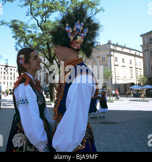 Young couple in traditional clothes in Cracow, Poland Stock Photo