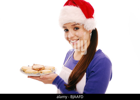 Home cooked mince pies flour on face Stock Photo