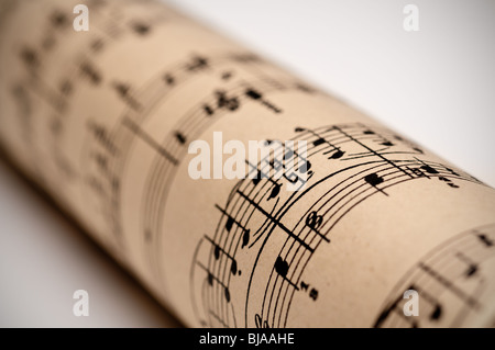 a roll of sheet music on old discolored parchment Stock Photo