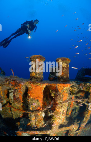 Diver scuba diving on the Rubis wreck in the Mediterranean Sea Stock Photo