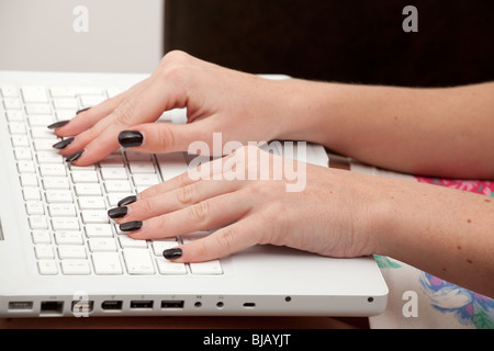 Close up of a woman using her laptop. Stock Photo