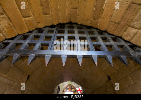 The two portcullis in the gatehouse at Warwick castle in the UK Stock Photo