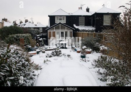 beachside property in island wall covered in snow whitstable kent england uk Stock Photo