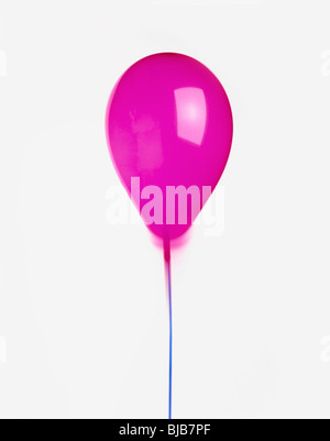 purple helium balloon with ribbon cut-out on white background Stock Photo