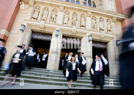 Student graduates leave University of Birmingham great hall after graduating from their degree courses. Stock Photo