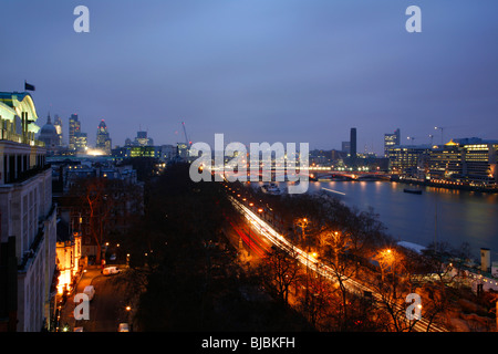 View down the River Thames at dawn towards Blackfriars Bridge and the City of London, UK. Taken from Victoria Embankment. Stock Photo