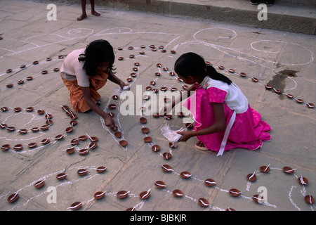 India, Varanasi, Ganges river, Kartik Purnima festival, children preparing candles Stock Photo