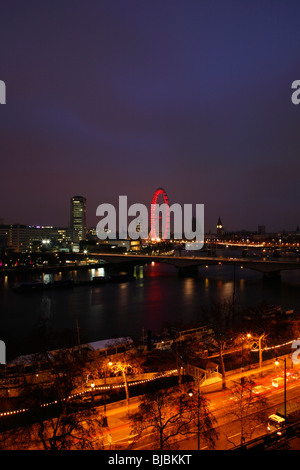 River Thames at dawn looking towards South Bank, London Eye and Westminster, London, UK Taken from Victoria Embankment. Stock Photo