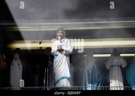 A statue of the Mother Teresa in a souvenir shop window in Knock village, County Mayo, Ireland. Stock Photo
