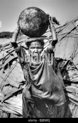 Elderly Galeb Tribe Woman Holding Cooking Pot, Omo Rati, Omo Valley, Ethiopia, Africa Stock Photo