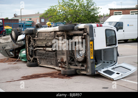 Van crashed on side - exercise Stock Photo