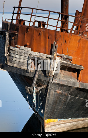 Old rusty pirate ship anchor laying on the ground Stock Photo - Alamy