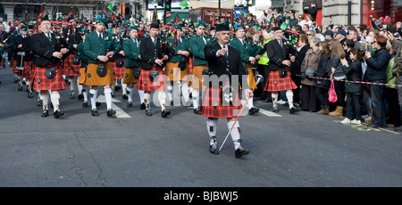 A pipe band marching during the St Patricks Day parade in London. Stock Photo