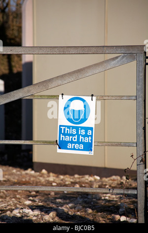 This is a hard hat area sign on gate Stock Photo
