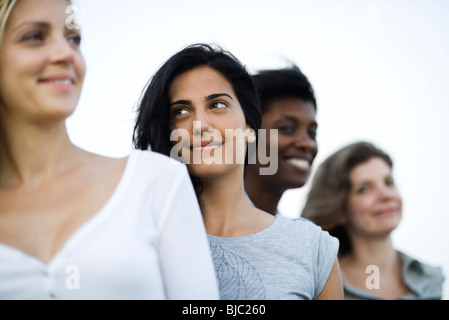 Young woman with friends, portrait Stock Photo