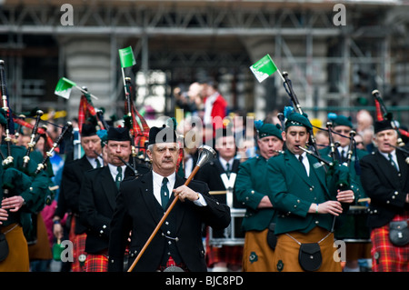 A pipe band marching in the St Patricks Day Parade in London. Stock Photo