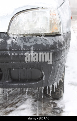 car with icicles hanging from the underside Stock Photo