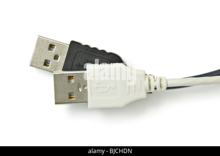 Close up of black and white USB leads on white background Stock Photo