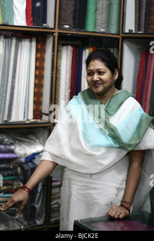 Portraits of people in the streets in New Delhi, woman in a shop Stock Photo