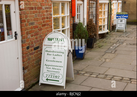 A traditional row of small shops in a shopping parade within Chesham town centre Buckinghamshire UK Stock Photo