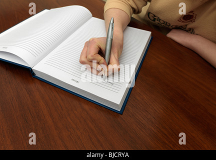 Hand Holding Pen Wrinting Notes Close up Stock Photo