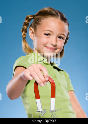 Child holding a magnet. Stock Photo