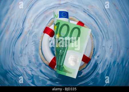 Money in a life saver. Stock Photo