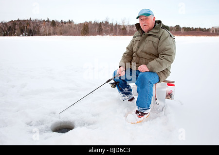 Man Sitting on Stool Ice Fishing · Free Stock Photo