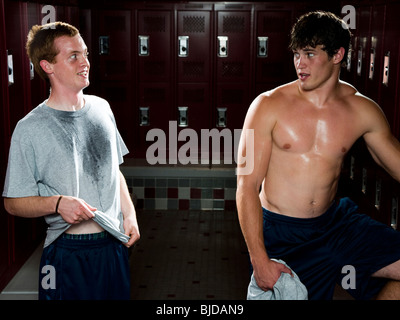 Two High School students in a locker room. Stock Photo