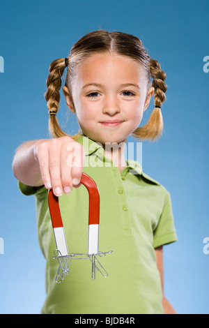 Child holding a magnet. Stock Photo