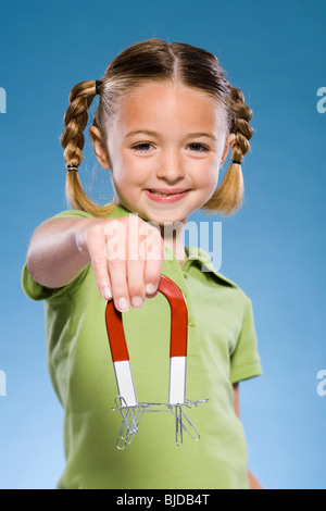 Child holding a magnet. Stock Photo