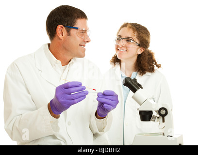 Two scientists working together in a laboratory. The younger one could be a student. Isolated on white. Stock Photo