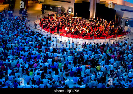 Paris, France, High Angle View, Public Events, Classical Music Orchestra Performing under the Pyramid at the Louvre Museum, fête de la musique crowd scene from above, symphony stage Stock Photo
