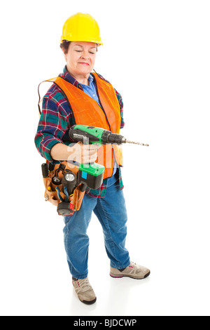 Female construction electrician using a power drill. Isolated on white background. Stock Photo