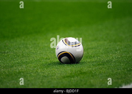 Jabulani, official matchball of th FIFA Football World Cup 2010 in South Africa on  green pitch Stock Photo