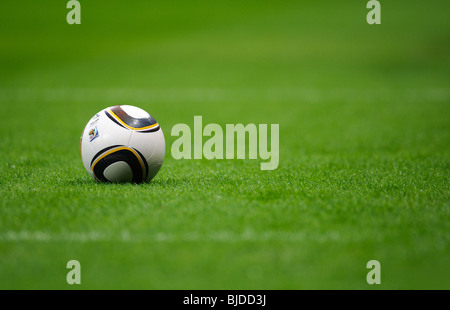 Jabulani, official matchball of th FIFA Football World Cup 2010 in South Africa on  green pitch Stock Photo
