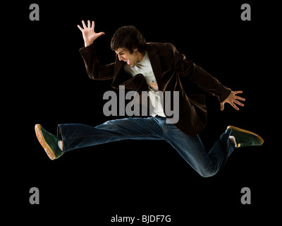 Young man jumping in the air. Stock Photo