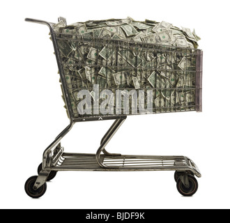 Shopping cart full of American dollars. Stock Photo