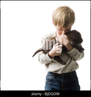 child with puppy Stock Photo