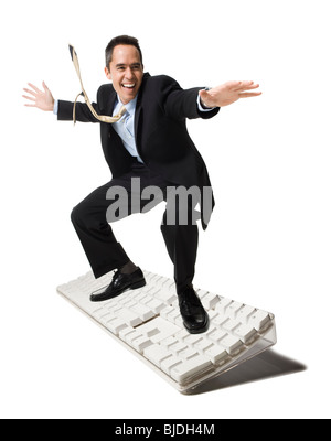 businessperson surfing on a keyboard Stock Photo