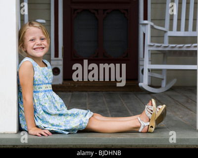 girl sitting on the front porch Stock Photo - Alamy
